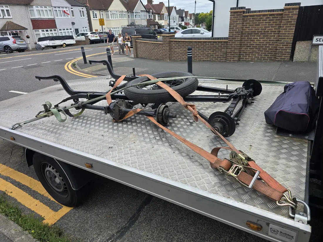 Trailer chassis and spare wheel, strapped down