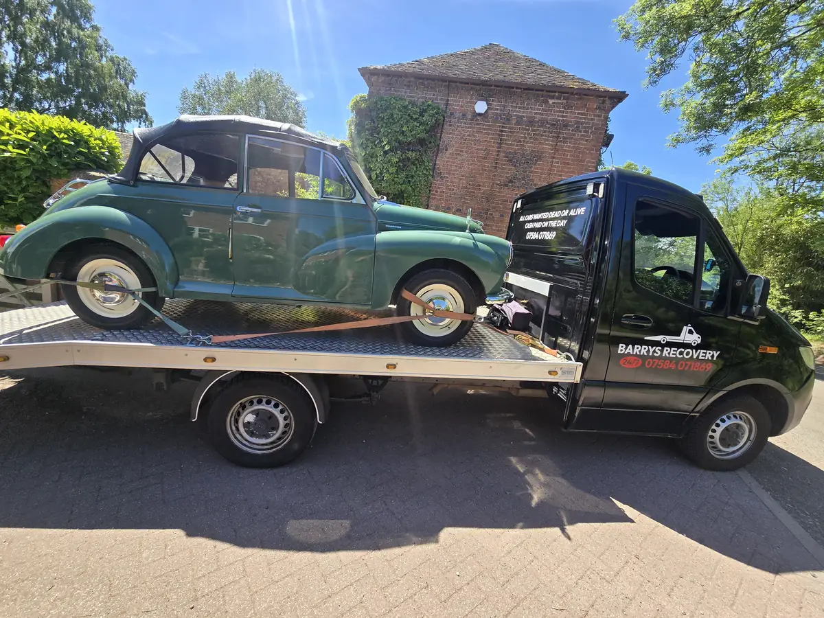 Classic Morris Minor tourer on the black Sprinter